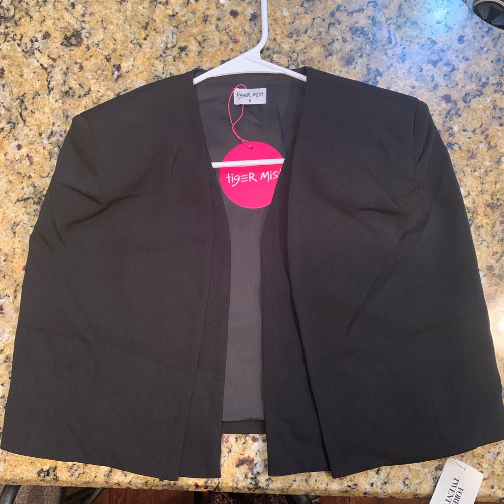 Must have Cape Vest to spice up a pair of jeans or dress.